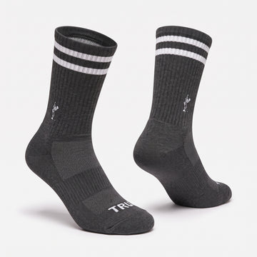 Create a ghost mannequin version of this crew sock.  Reference 2 is the pose we'd like to match. Place on a clean #f2f2f2 background.